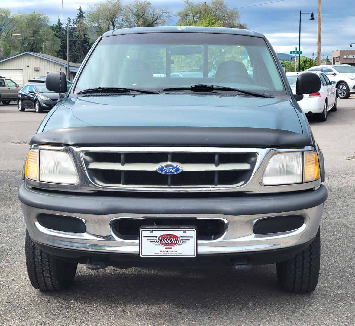 1997 Green /Tan Ford F-250 (1FTFX2866VK) with an 4.6L V8 engine, 4 Speed Manual with Overdrive transmission, located at 450 N Russell, Missoula, MT, 59801, (406) 543-6600, 46.874496, -114.017433 - 4.6L V8 Engine. 4 Speed with Overdrive Manual Transmission. 4 Wheel Drive. 3 Door. Short Box. Air Conditioning. Cruise Control. Financing is NOT Available. - Photo#2